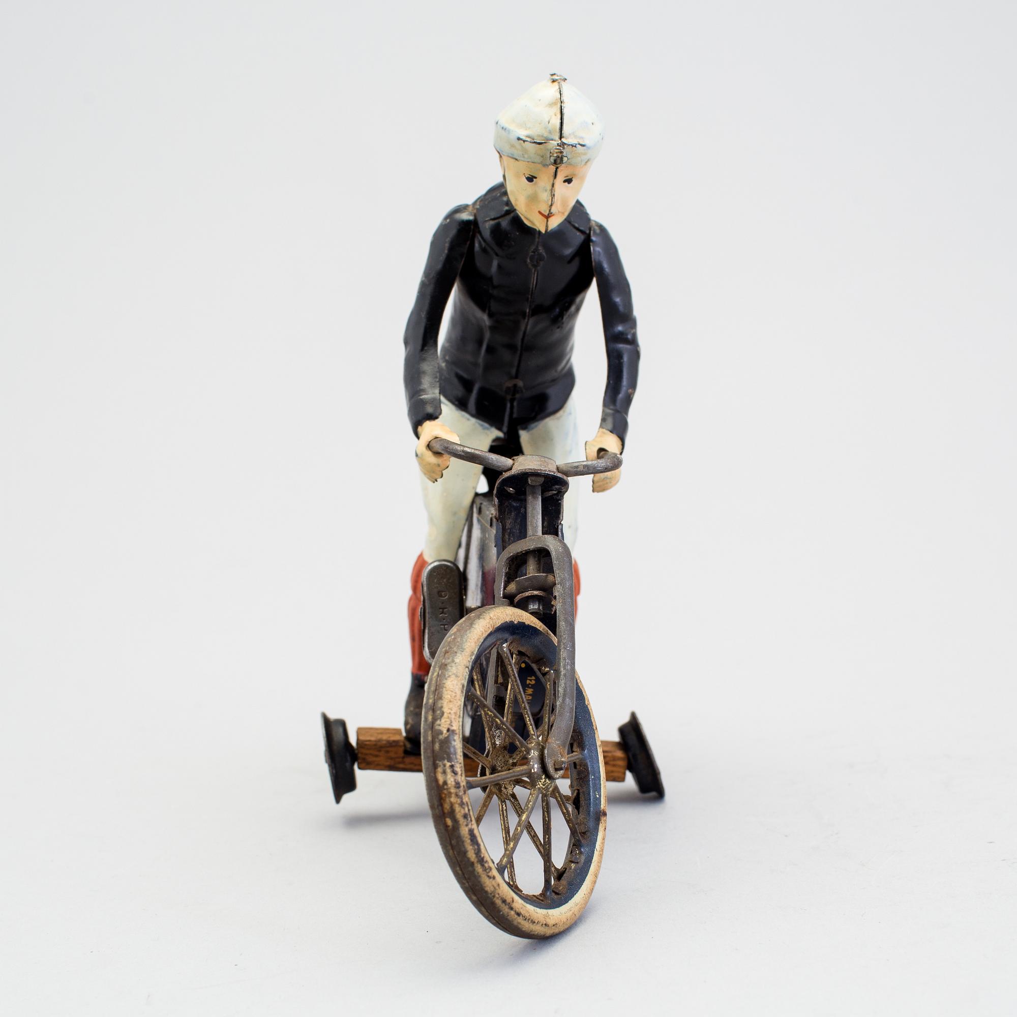 A partially hand painted tinplate Lehmann Halloh motorcycle, Germany. In production 1914-41.