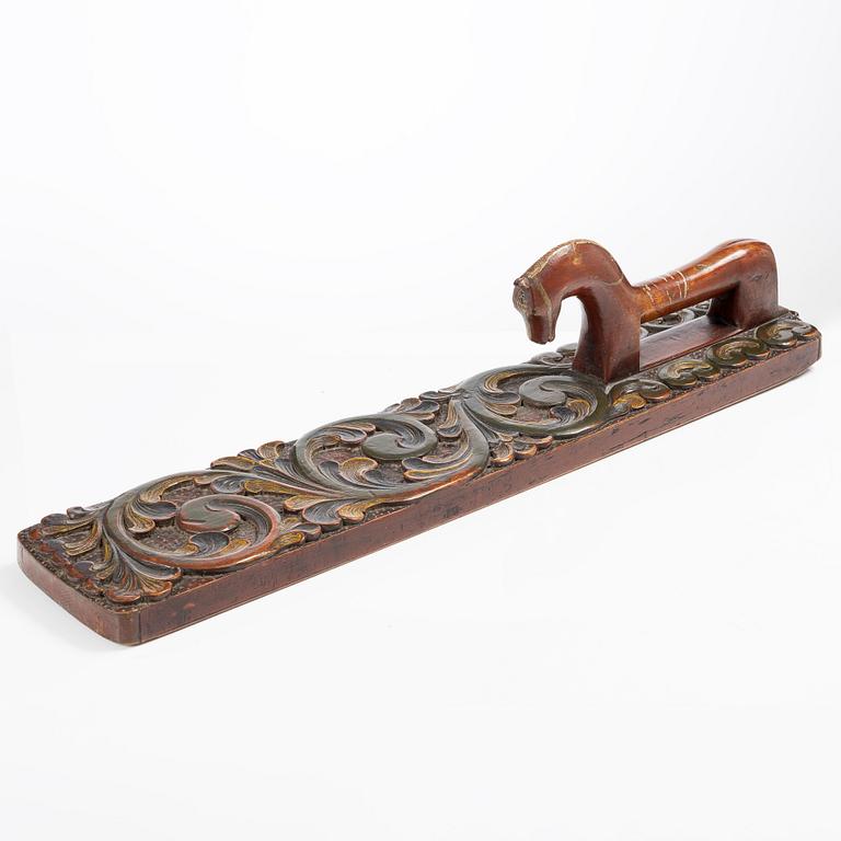 A carved and polychrome painted mangle board, Sweden, late 18th / early 19th century.