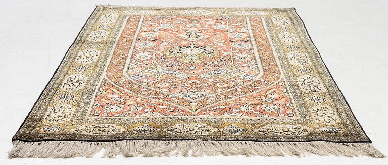 A silk Qum rug, c. 172 x 105 cm.