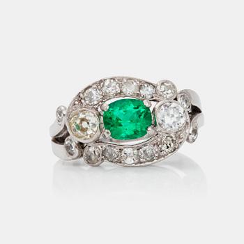 763. An emerald and brilliant-cut diamond ring. Total carat weight of diamonds circa 1.10 cts.