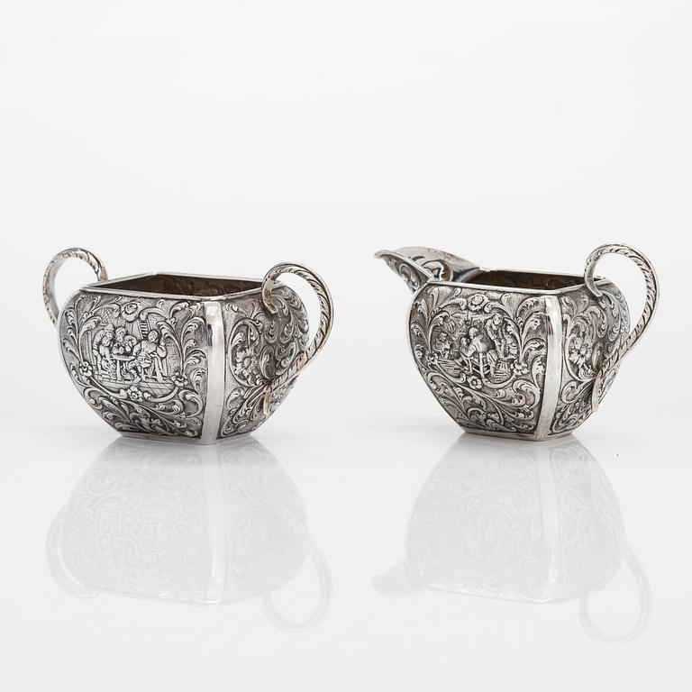 A 1940s Dutch silver sugar bowl and cream jug on a tray, Amsterdam, 1947 and 1942.