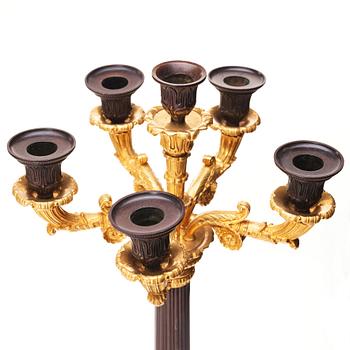 A pair of French Louis Philippe six light candelabra, around 1830.