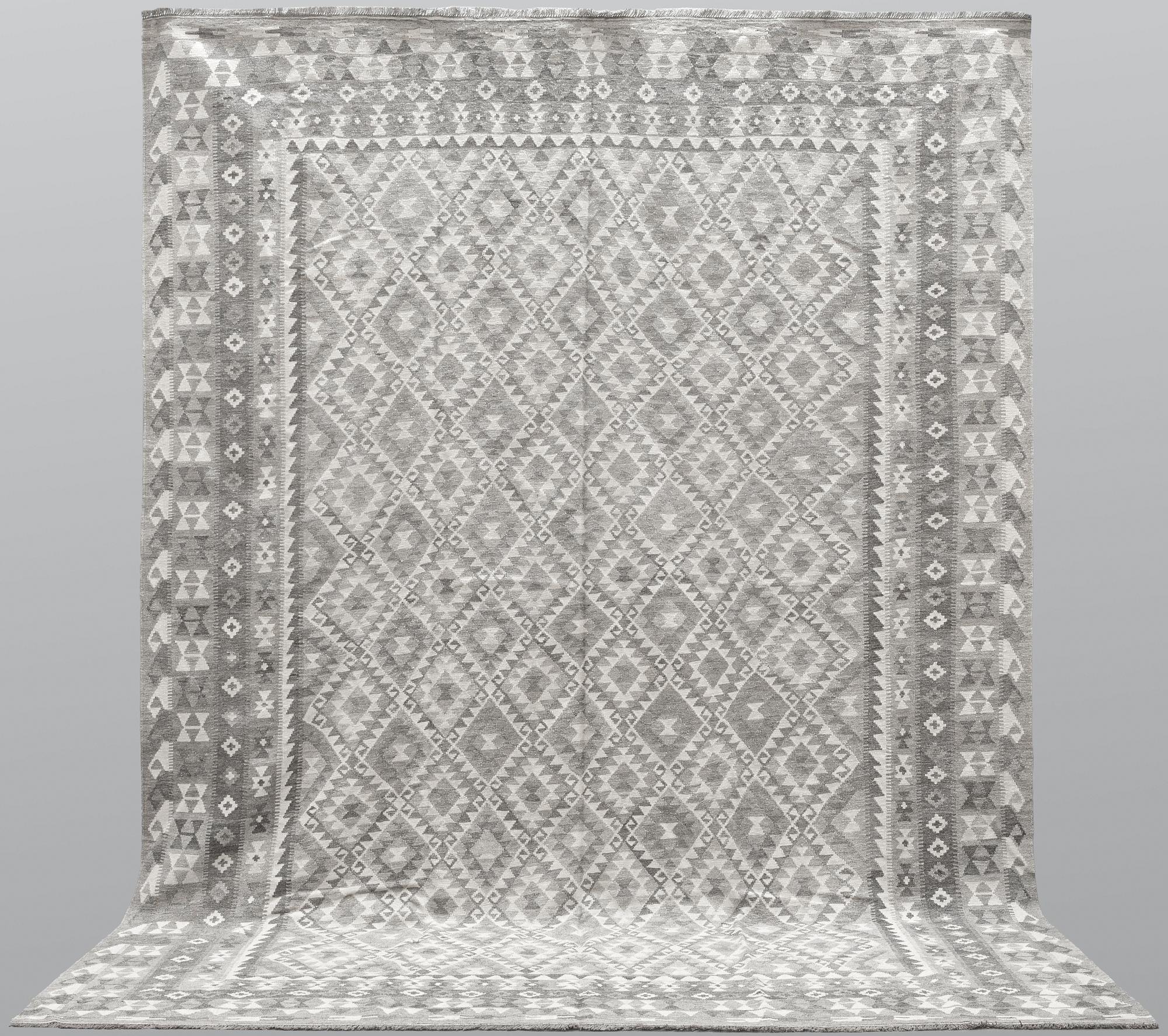 A carpet, kilim, ca 390 x 298 cm.