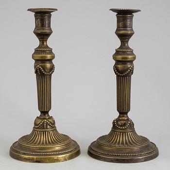 A PAIR OF BRONZE GUSTAVIAN CANDLESTICKS, 18th century.