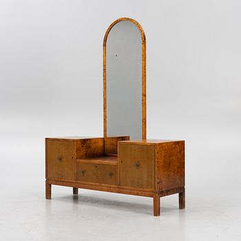 A 1930's dresser with mirror.