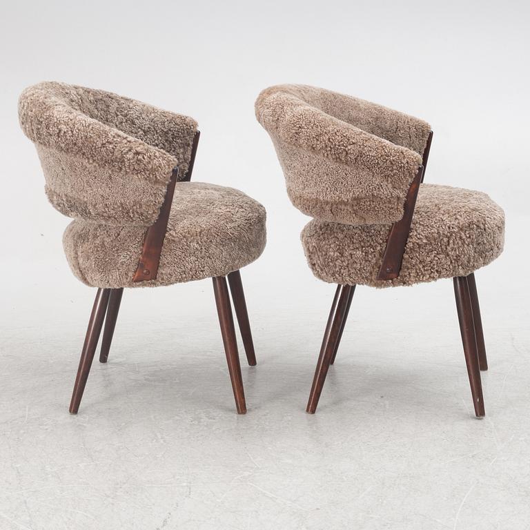 A pair of armchairs, AB Bröderna Biörs Snickerifabrik, mid-20th century.