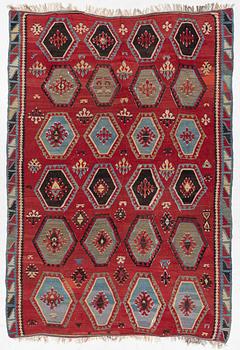 An antique/semi-attique kelim carpet, c. approx. 320 x 222 cm.
