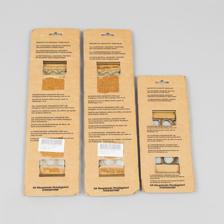 A set of three 'Dekorativ' coat hangers, Skoglunds metallgjuteri, Anderstorp, second half of the 20th century.