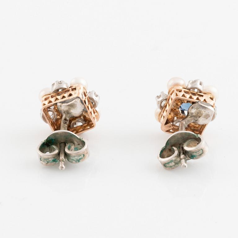 A pair of 18K gold and silver earrings set with rose-cut diamonds, pearls and blue stones.