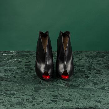 A pair of shoes by CHRISTIAN LOUBOUTIN, in size 37.