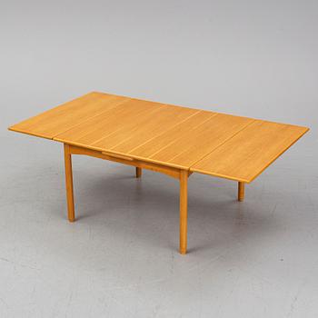 A Norwegian table, Heggen, 1950s-60s. Four leg extenders included.