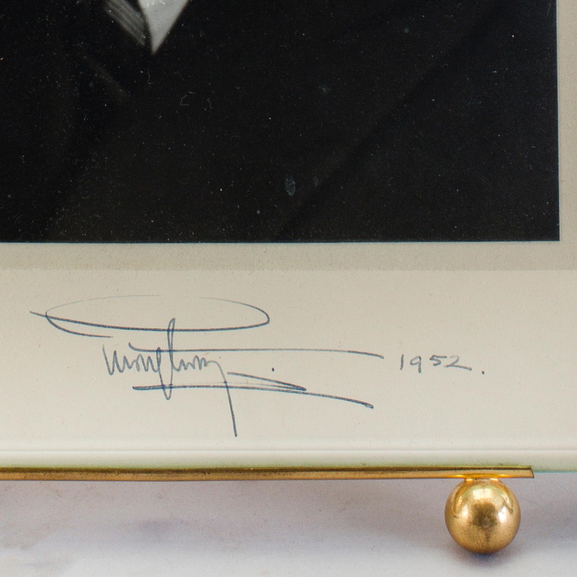 A royal photographic image picturing Gustav VI Adolf, signed and dated 1952.