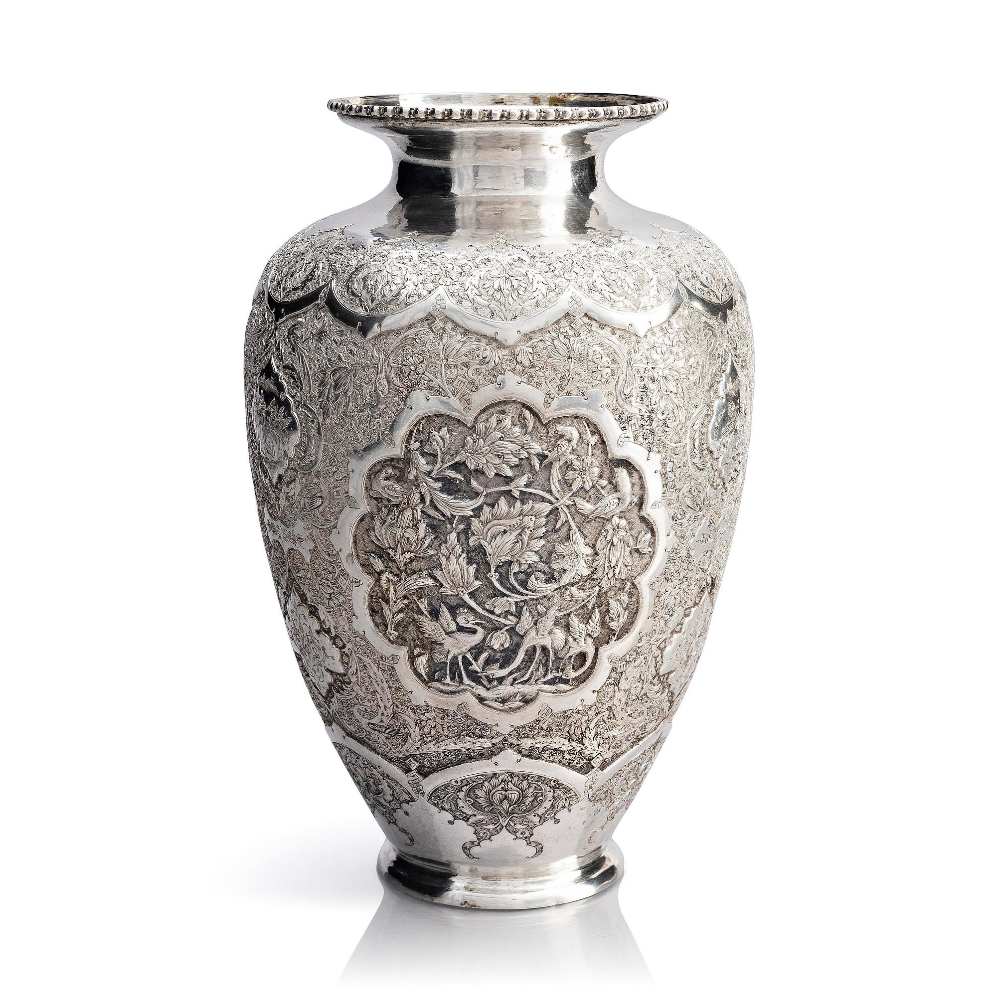 A Persian silver vase, late Qajar dynasty around 1910.