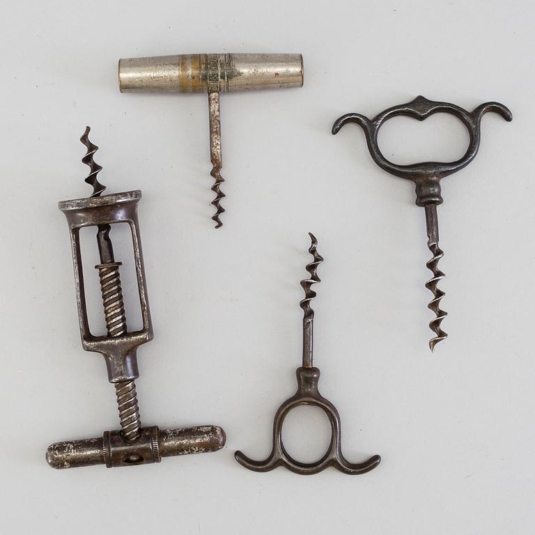 FOUR CAST IRON CORK SCREWS, 19th century.