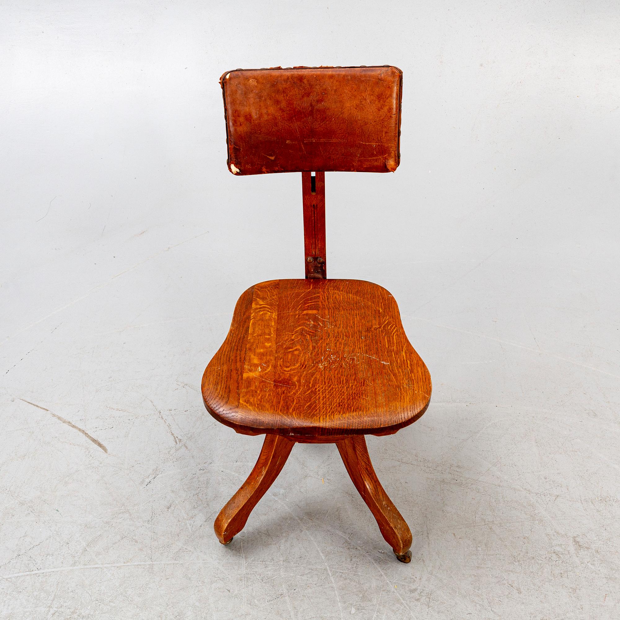 An early 1900s oak office chair.