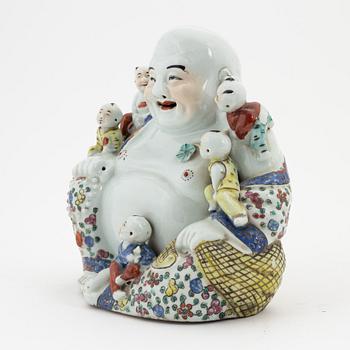 A porcelain 'Budai' figure, China, 20th Century.