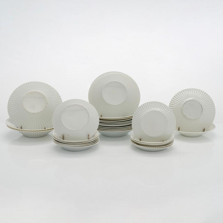 Aune Siimes, a set of twenty 1960's porcelain cream cups and twenty nine saucers for Arabia.