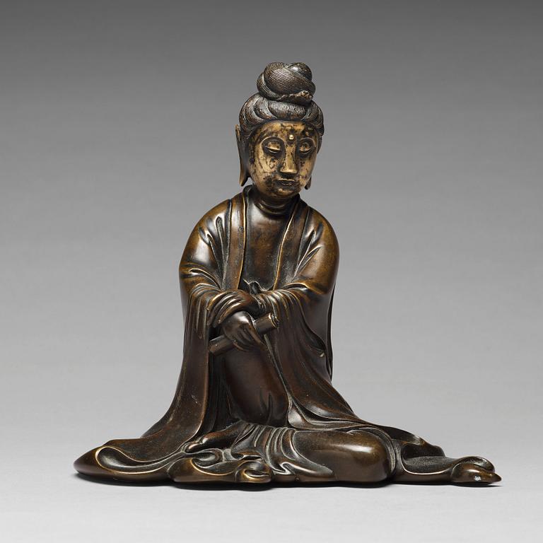 A bronze sculpture of a seated guanyin, 19th Century.