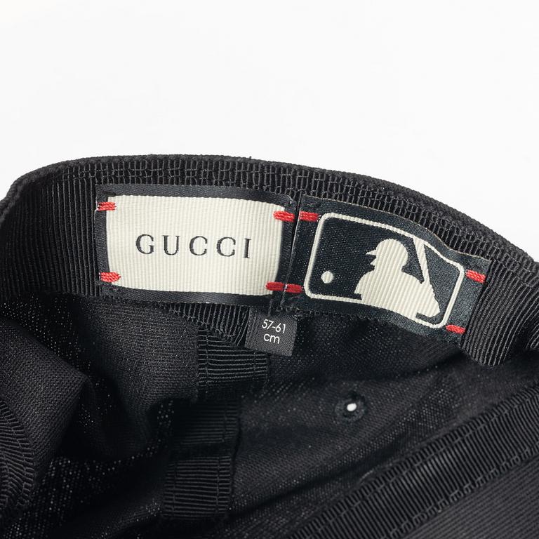 Gucci, NY Yankees baseball cap.
