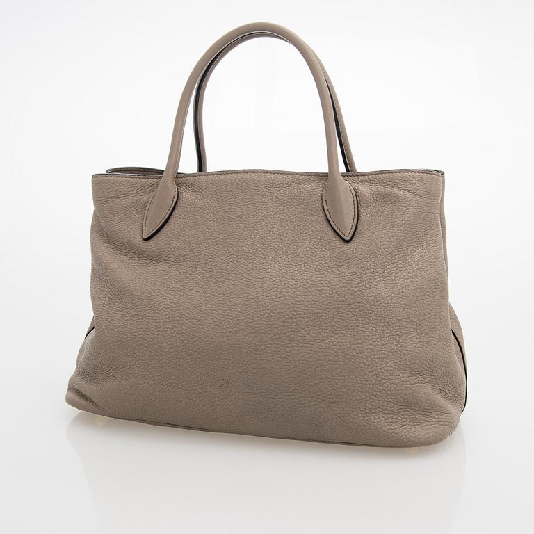 Prada, a clay gray leather handbag, 2020.