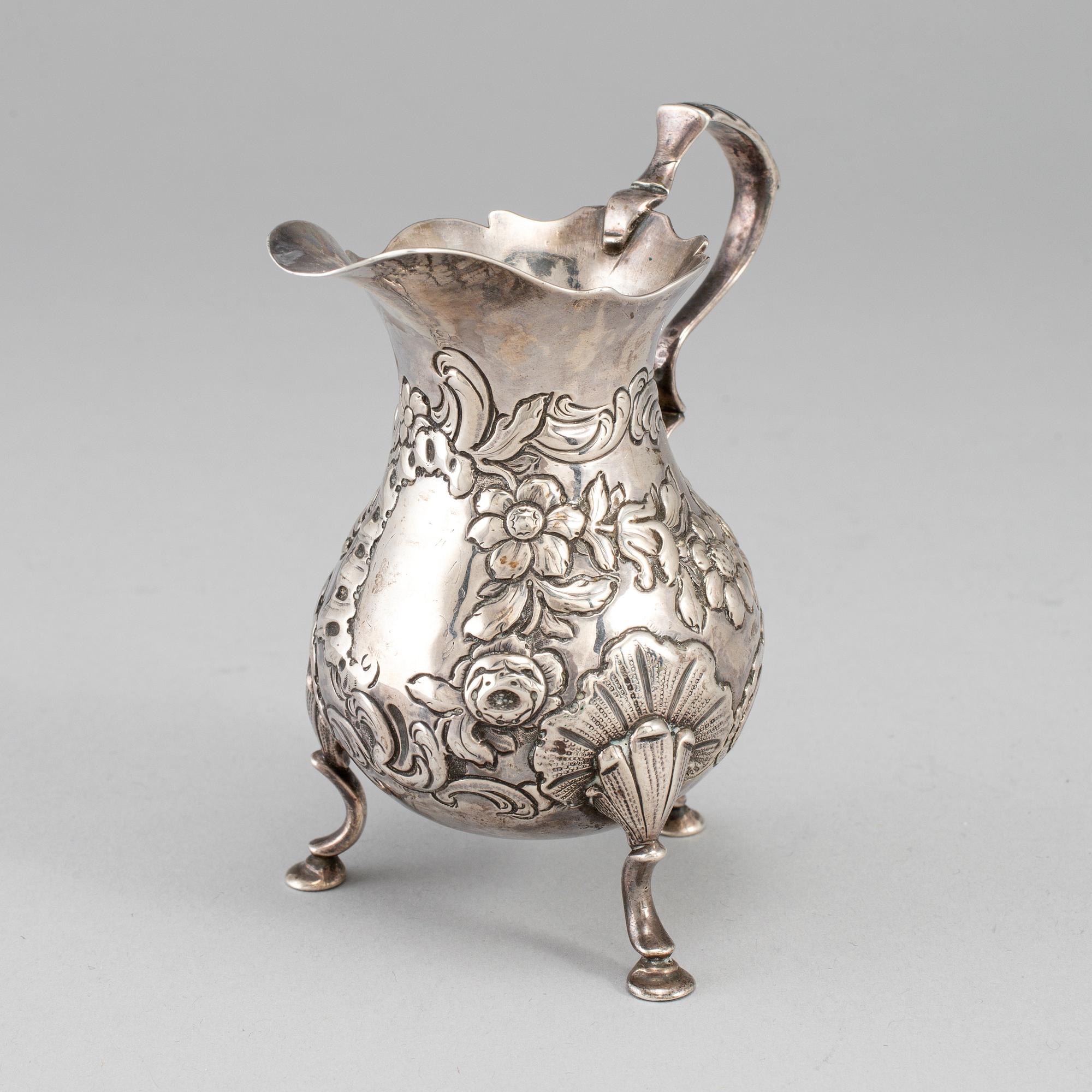 An English mid 18th century silver cream-jug, mark of David Hennell I, London 1754.