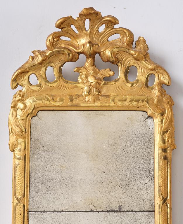 A rococo giltwood mirror by N. Meunier (master i Stockholm 1754-97).