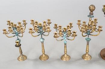 a metal sculpture group in eight parts, partly signed.