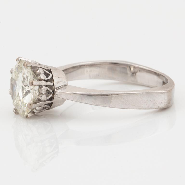 An 18K white gold ring set with an old-cut diamond.