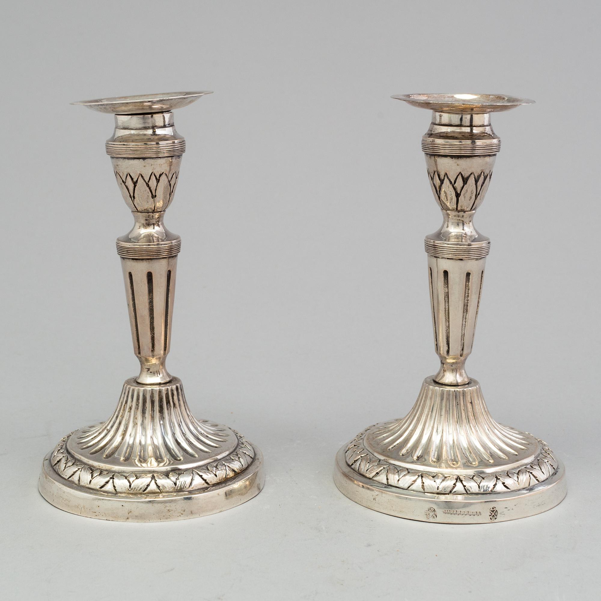 A pair of late 18th century silver candlesticks with unclear hallmarks, possibly from Germany. Weight ca 316 grams.