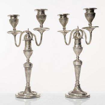 A pair of English silver candelabra, mark of Hawksworth, Eyre & Co Ltd, Sheffield 1892.