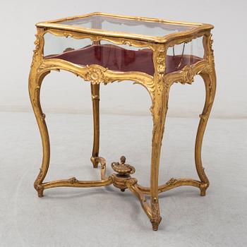 A Louis XV style display table, first half of the 20th century.