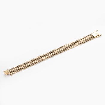 A 14K gold X-link bracelet, likely Norway.