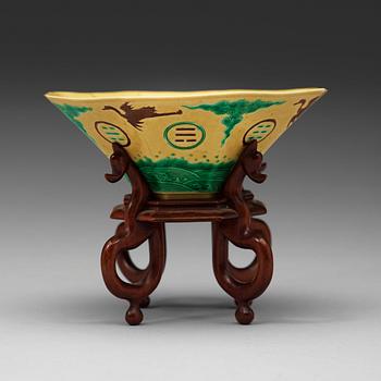 452. A yellow, green and aubergine glazed bisquit bowl, Qing dynasty, 18th Century.