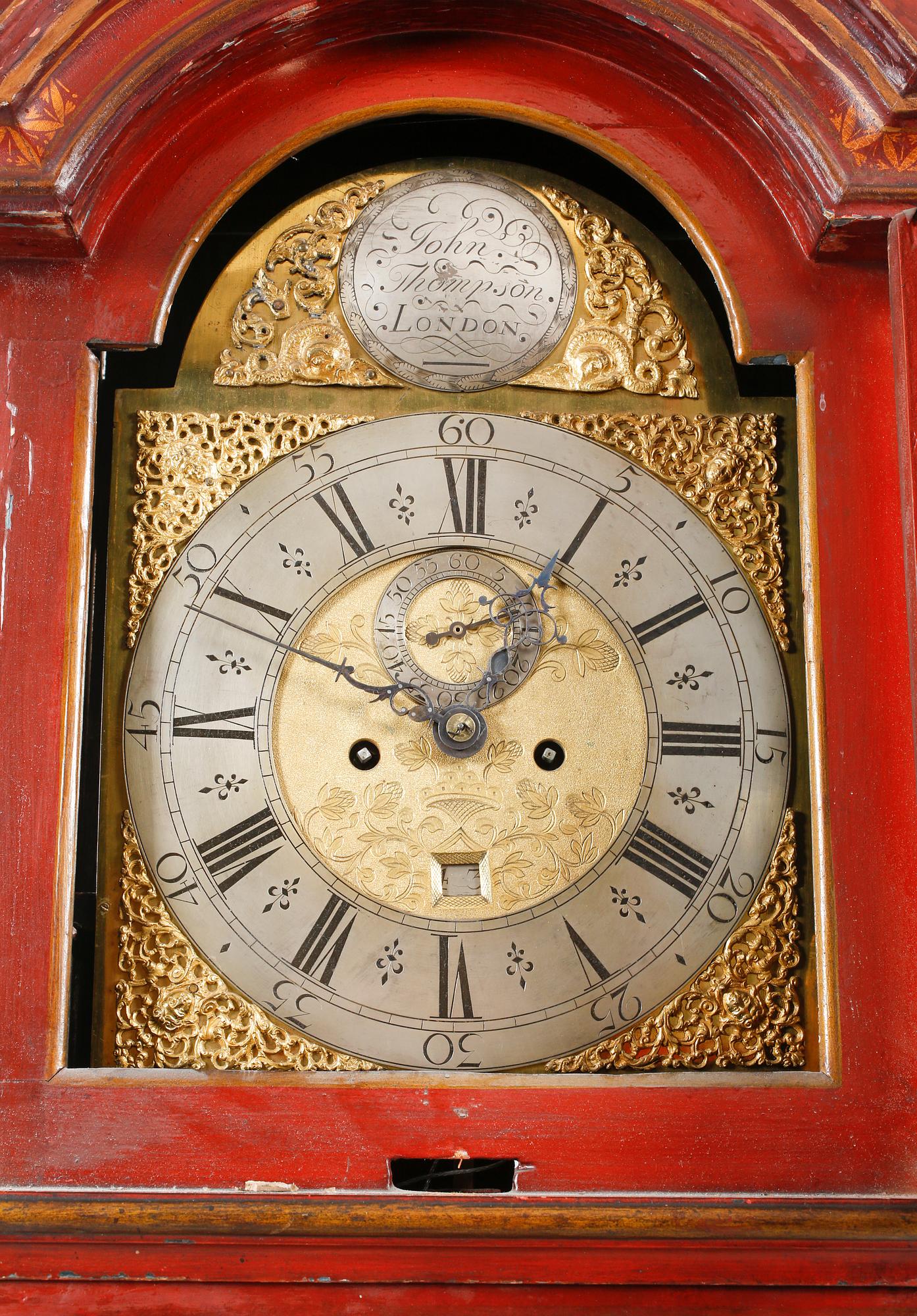 A grandfather clock, dial marked "John Thompson, England", 19th century.