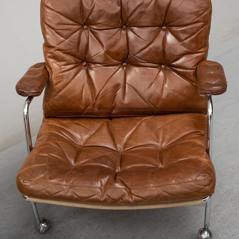 A pair of 'Karin' leather easy chairs by Bruno Mathsson, late 20th Century.