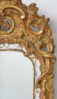 A rococo giltwood mirror attributed to N. Meunier (master in Stockholm 1754-97).