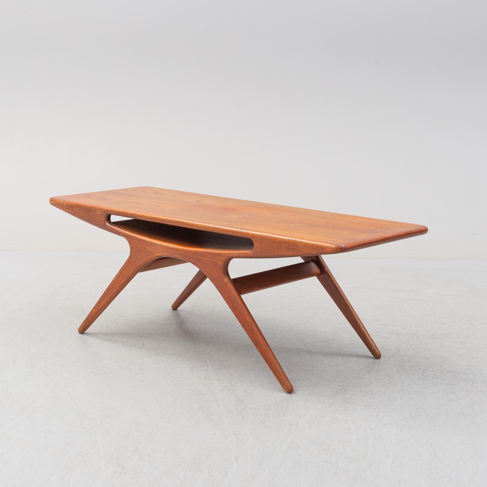 A 1950s teak veneered 'Smile' coffee table by Johannes Andersen for CFC Silkeborg, Denmark.