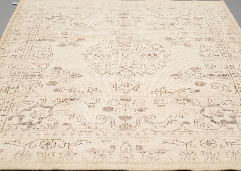 An oriental carpet, ca 250 x 204 cm.