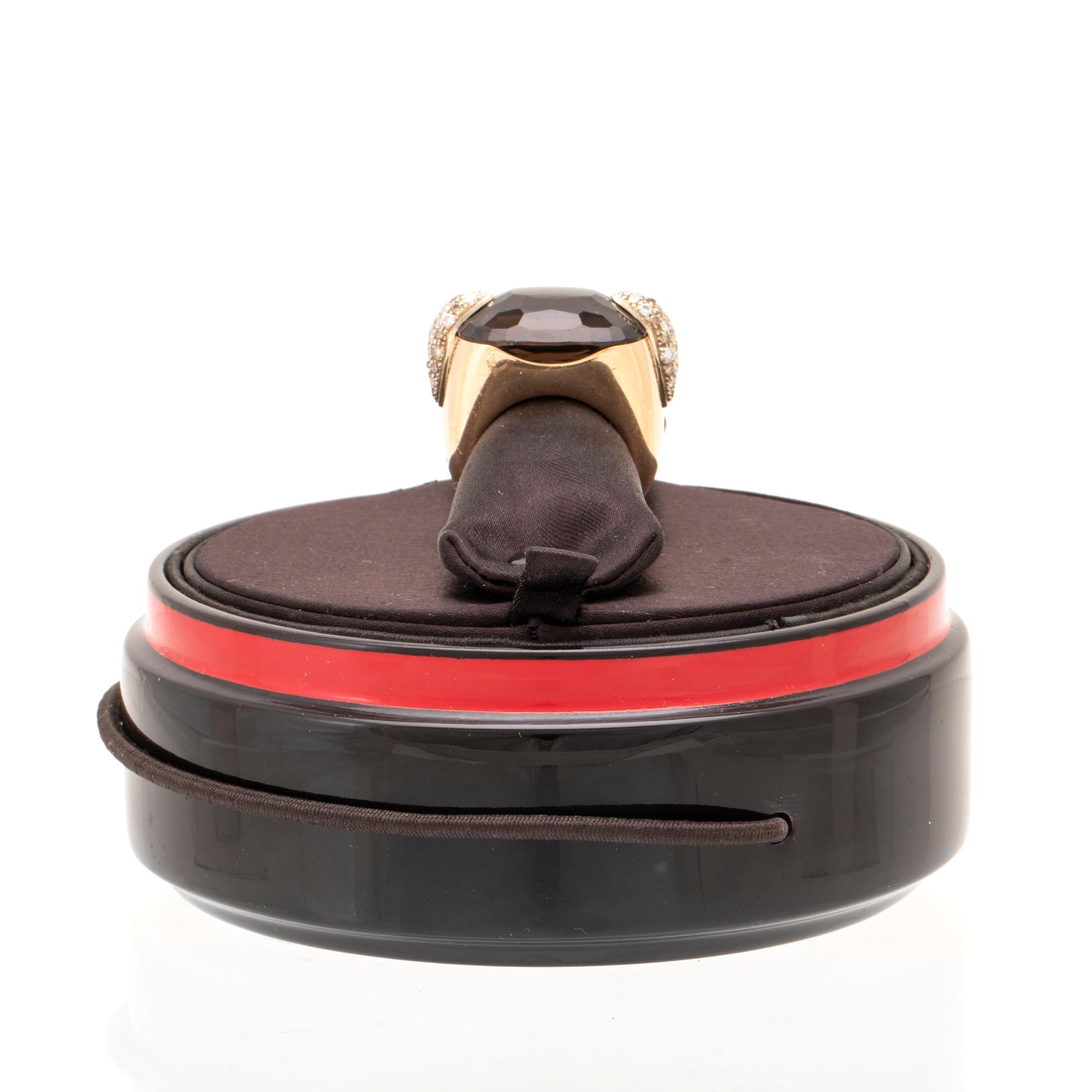 An 18K gold Pomellato "Pin Up" ring set with smoky quartz and round brilliant-cut diamonds.