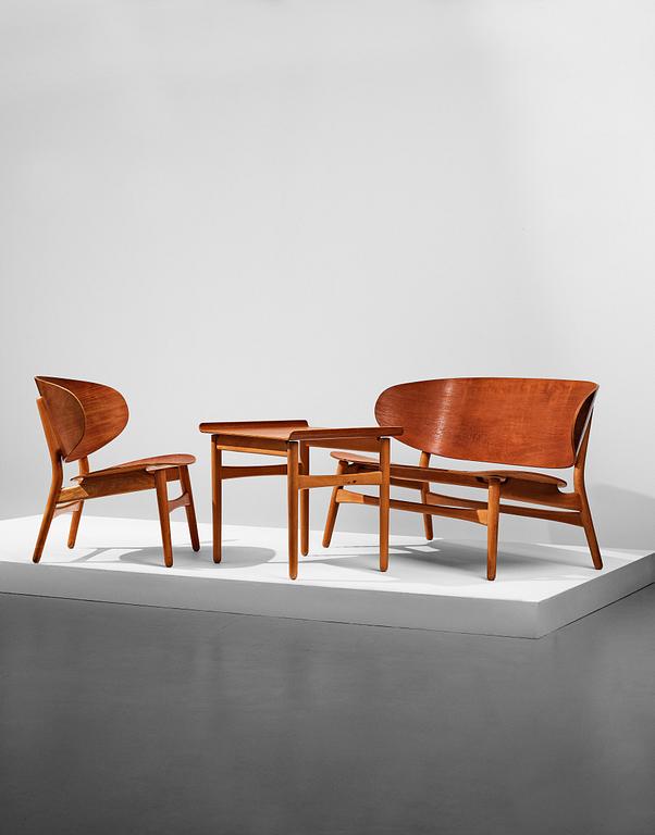 A HANS J WEGNER, a  "Shell set/ Skalsæt" comprising a sofa, a chair and a table, Fritz Hansen, Denmark 1950's.