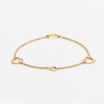 Tiffany & Co, an 18K gold 'Open Heart' bracelet.