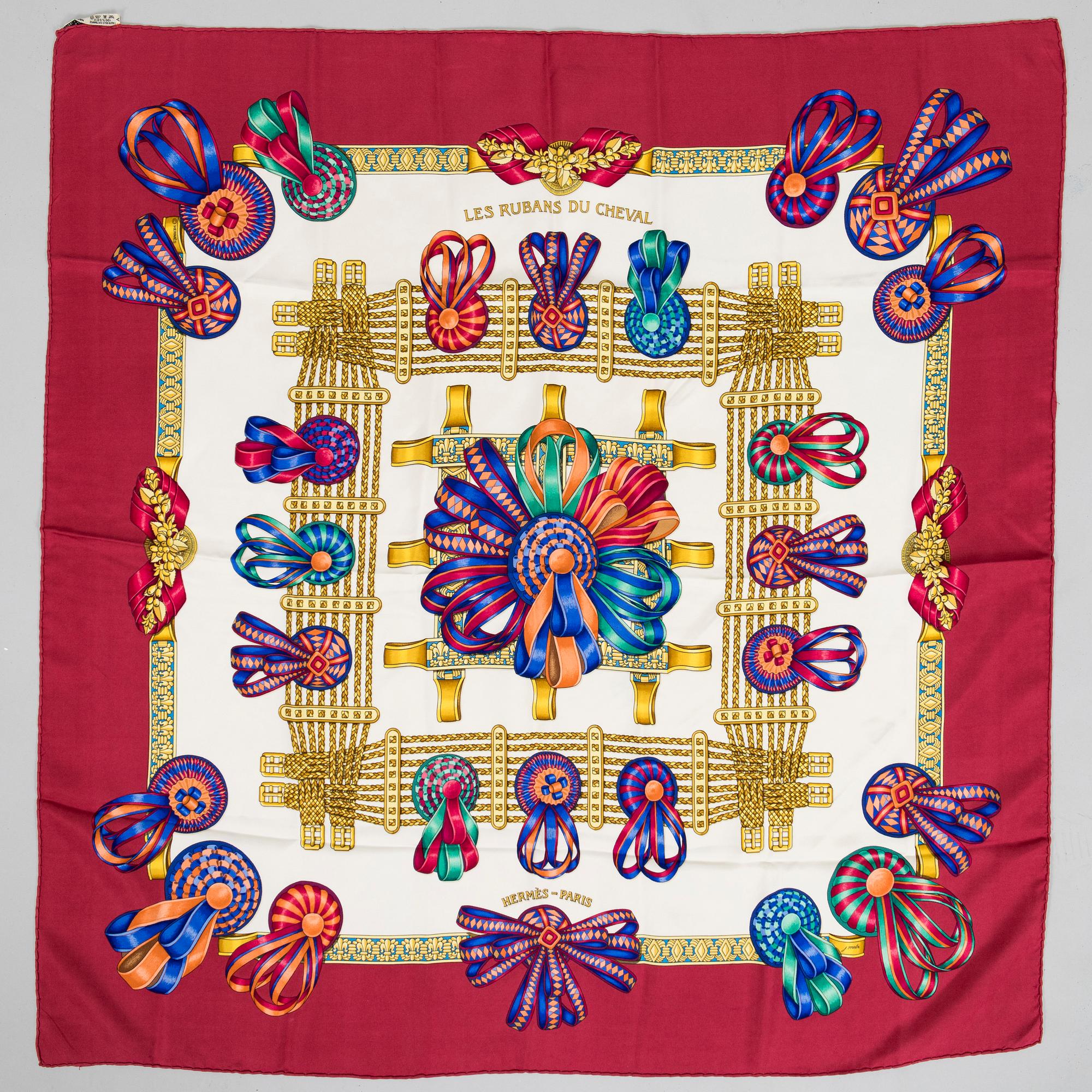 Hermès, a 'Les Rubans du Cheval' silk scarf.
