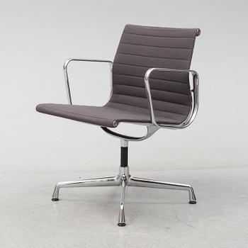 An 'EA 104 Swivel' armchair by Charles & Ray Eames, Vitra, 2007.