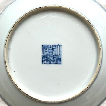 A pair of blue and white floral dishes, Qing dynasty, with Qianlong mark and of the period (1736-95).