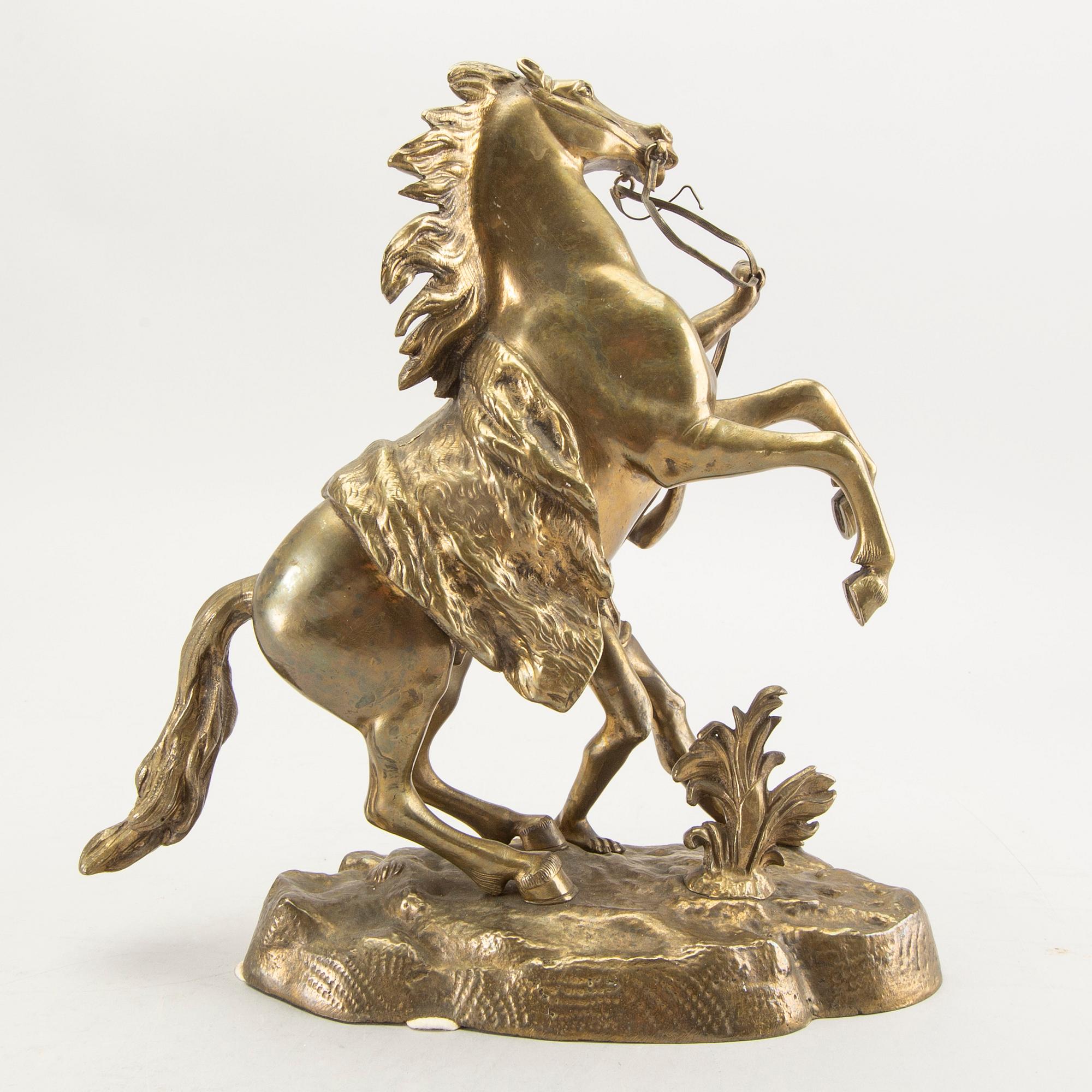 A bronze sculpture after Guillaume Coustau.