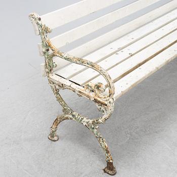 A cast iron and wood garden sofa, early 20th Century.