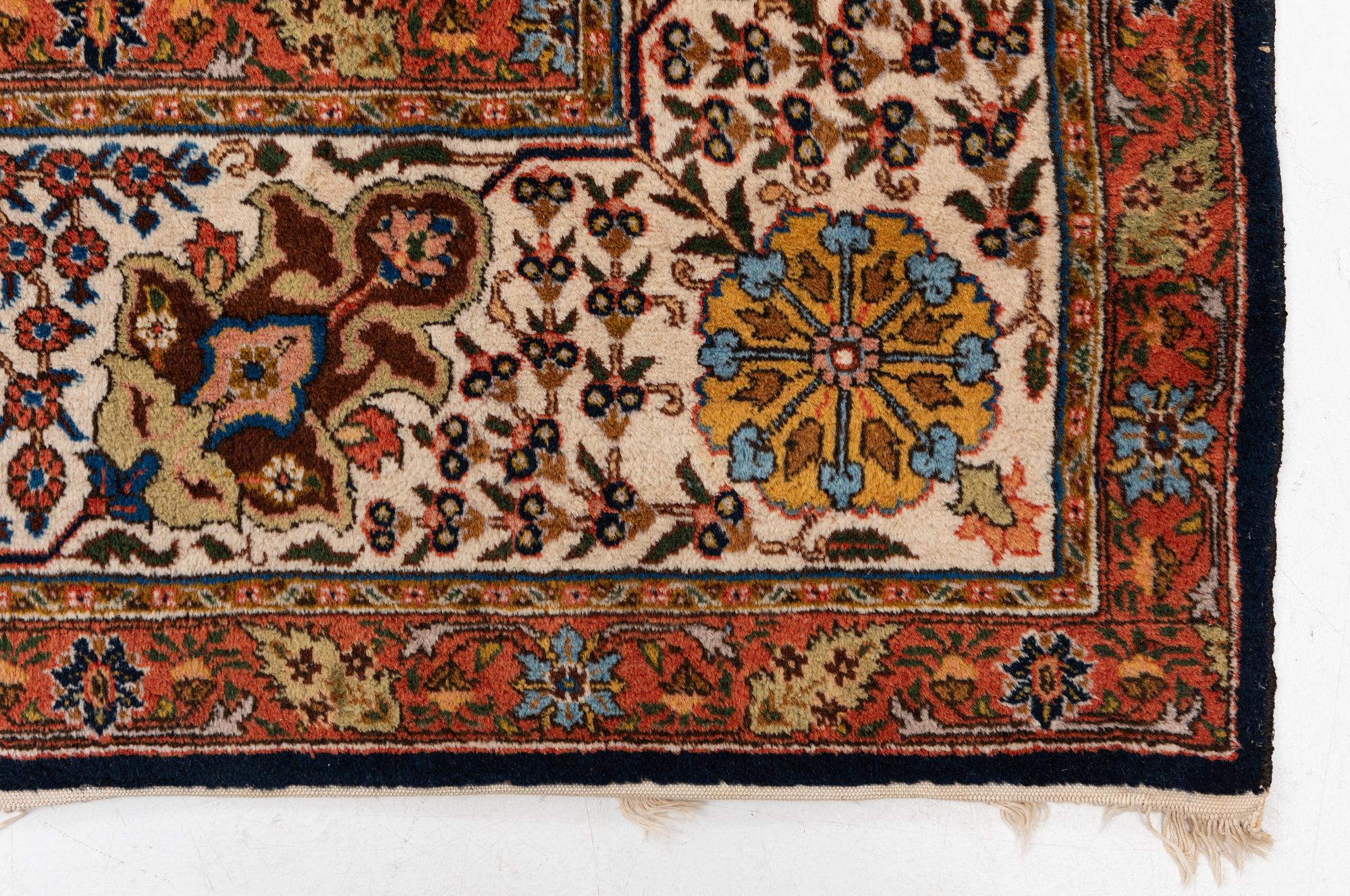 A semi-antique Tabriz carpet, c. 395 x 295 cm.