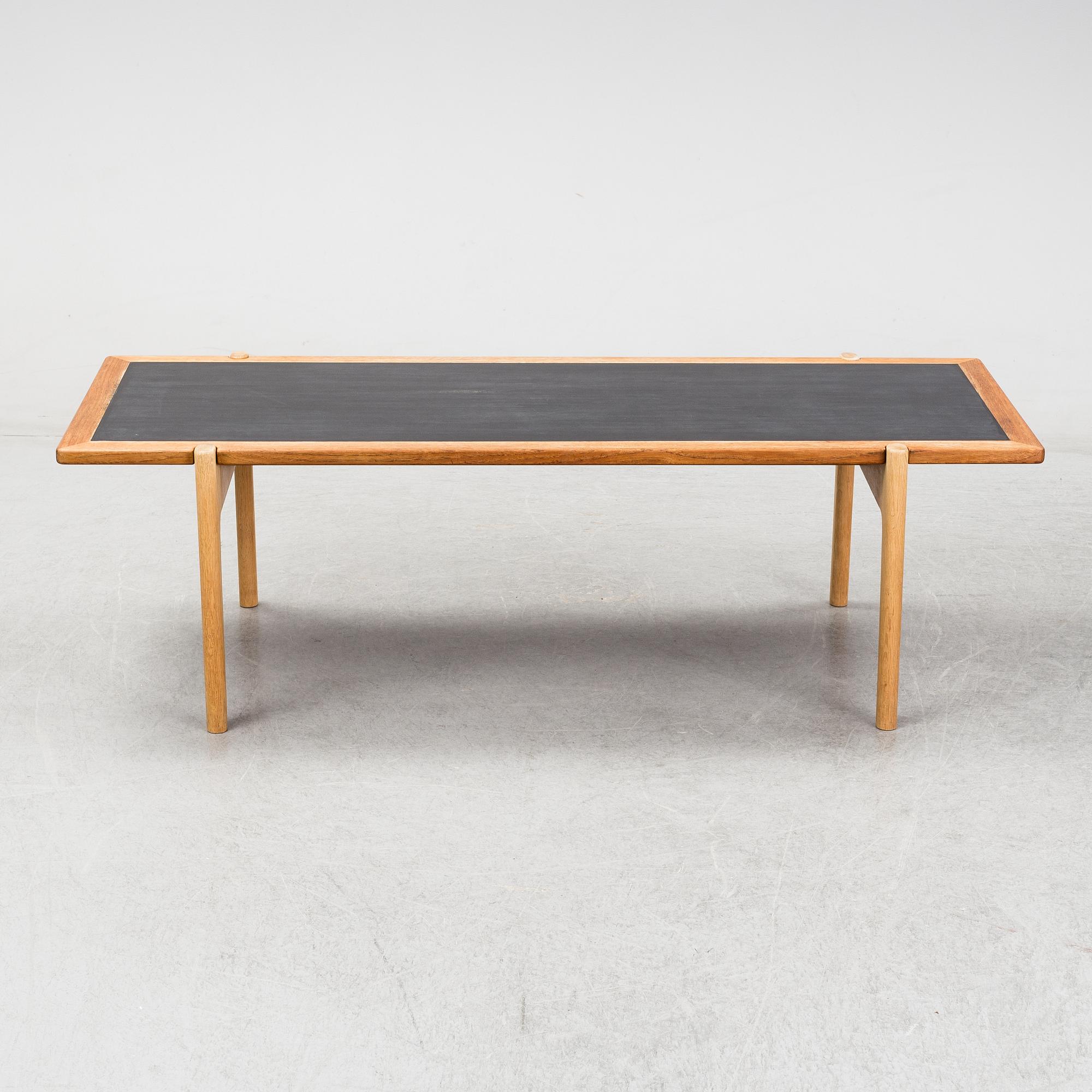 A model JH 575 coffee table by Hans J Wegner for Johannes Hansen.