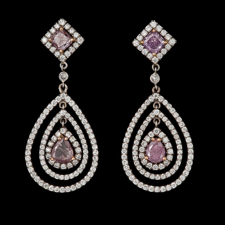 A pair of Fancy coloured diamond, total carat weight circa 1.59 cts and colourless diamond earrings.