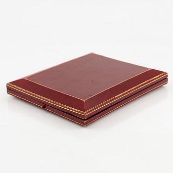 A necklace/tiara combination in 18K gold and green enamel set with old-cut diamonds.